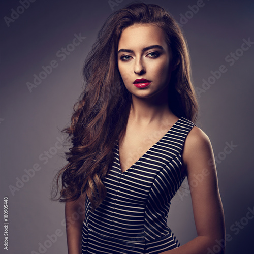 Beautiful Woman With Bright Makeup And Long Hair Red