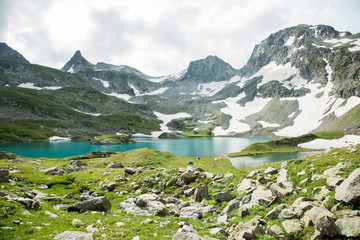 A team of hikers, climbers in the high mountains