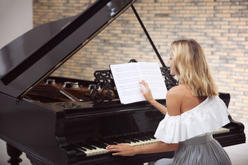 Poster - Talented woman playing piano indoors