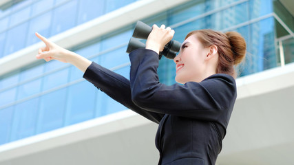 Wall Mural - Business woman with binocular