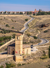 Wall Mural - An old church built in Roman Empire period stands on the hillside road not far from the village of Segovia, Castilla y Leon, Spain.