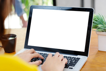 Woman hands typing laptop computer with blank screen for mock up template background, business technology and lifestyle background concept