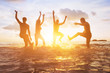© Song_about_summer - crowd of friends having fun in the water at sunset, silhouettes of happy people enjoying summer holidays