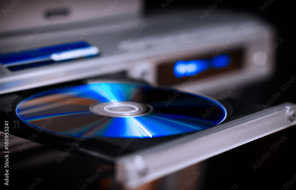 DVD disc inserting to player - obrazy, fototapety, plakaty 