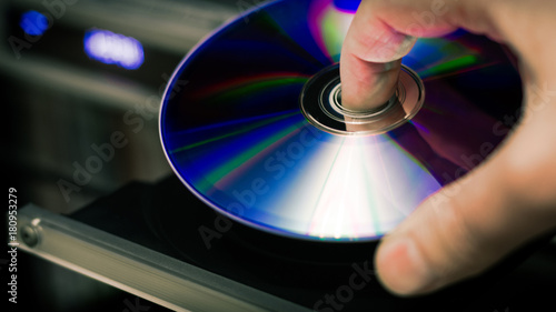 Fotomural DVD disc inserting to player