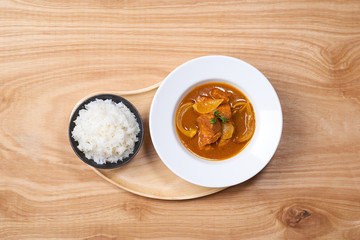 Wall Mural - Chicken curry in a bowl / Vietnam chicken curry on wooden background