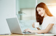 © jumlongch - Young asian girl is freelancer with her private business at home office, working with laptop, coffee, online marketing, Customer order and packaging or packing.