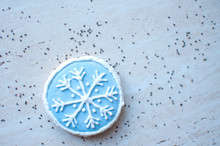 A Christmas Gingerbread Cookie In The Shape Of A Blue Round Snowflake. Top View, Flat Lay, Copy Space.