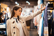 © NDABCREATIVITY - Beautiful brunette buying clothes