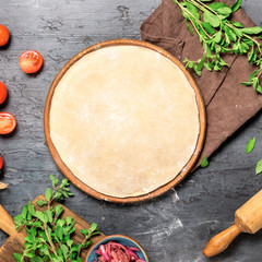 Wall Mural - Raw pizza dough with set ingredients for cooking vegetarian pizza