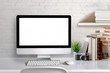 © bongkarn - Mock up : Stylish or designer workspace with desktop computer, creative supplies, houseplant and vintage books on white work table at home or studio. Blank screen for graphics display montage.