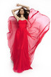 © EVGENY FREEONE - Brunette model in red dress posing
