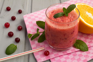 Wall Mural - Smoothie from cranberry and orange on the pink napkin