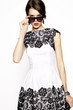 © EVGENY FREEONE - Fashionable woman in white short dress