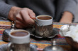 Woman enjoying turkish coffee close up