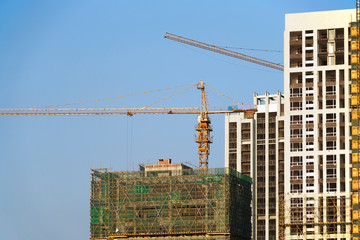 Poster - building construction site with construction frame and crane