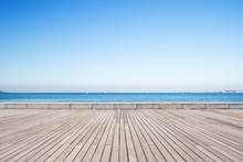 Empty Wooden Floor With Blue Sea In Blue Sky