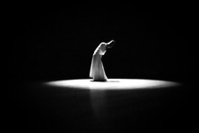 The Image Of A Whirling Dervish In The Darkness