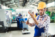 © NDABCREATIVITY - Male worker and quality control inspection in factory