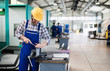© NDABCREATIVITY - industrial factory employee working in metal manufacturing industry