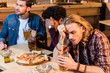 © LIGHTFIELD STUDIOS - friends with pizza and beer in bar