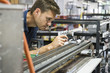 © PhotoAlto - Man working in factory