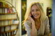 © PhotoAlto - Mature woman talking on cell phone