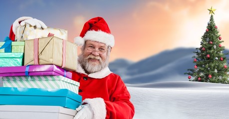 Poster - Santa holding gifts in Christmas Winter landscape with Christmas