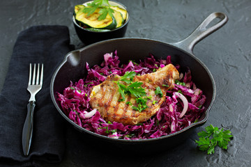 Canvas Print - Pork cutlet on a bone with a salad of red cabbage.