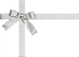 silver bow satin ribbon isolated on white background with clipping path for gift box wrap and holida