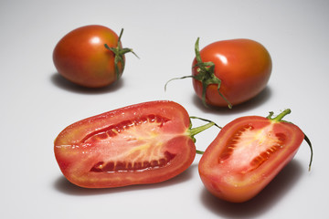 Tomatoes on light grey background