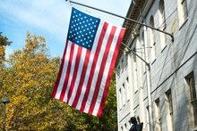 American Flag On The College Campus Building