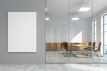 Gray office lobby and a meeting room with poster