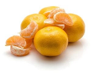 Tangerines isolated on white background four whole and separated segments.