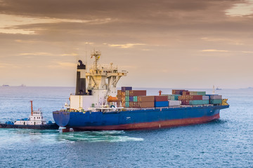 Wall Mural - Close view of big container ship arriving at port ready to berth. Port terminal. 