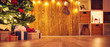 Old wooden planks with christmas decoration and fir tree at home. Brown background with gift boxes