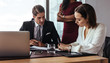 © Jacob Lund - Boss dictating to assistant at office