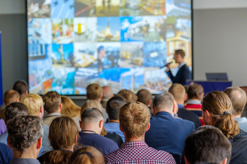 audience listens to the lecturer at the conference hall
