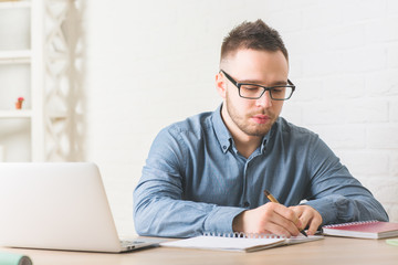 Canvas Print - Handsome man working on project