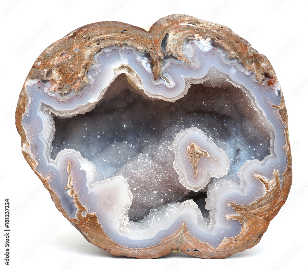 A polished geode filled with blue Chalcedony that is coverd in a thin layer of Quartz crystals. This specimen was found in Dugway, Utah, USA. - obrazy, fototapety, plakaty 