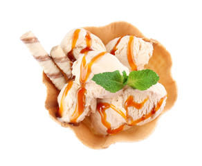 Poster - Waffle bowl with caramel ice cream on white background