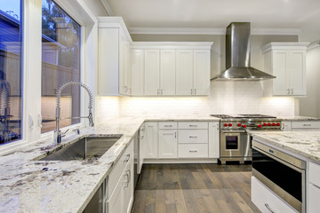 Large, spacious kitchen design with white kitchen cabinets