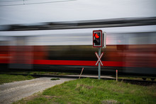 A Train Passing At A High Speed Around The Road, Austria, Europe