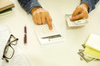 © busra - Woman hands holding paper money and calculator