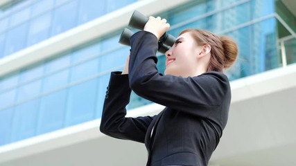 Wall Mural - Business woman with binocular