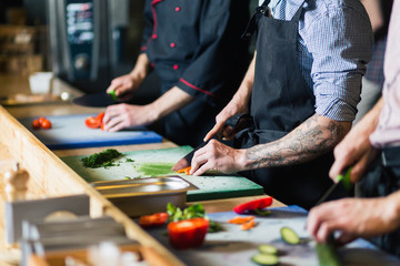 chef cooking food kitchen restaurant cutting cook hands hotel man male knife preparation fresh preparing concept - stock image