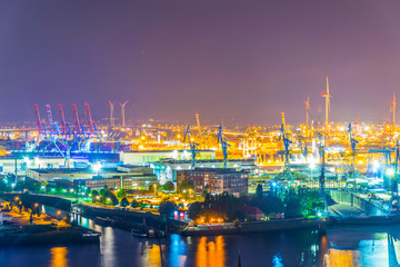 Wall Mural - Night view of cranes in the port of hamburg, Germany.