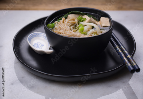 Fotografie, Obraz Japanese udon noodle soup with enoki mushroom, tofu and Gai lan