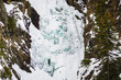 Person climbing a frozen waterfall