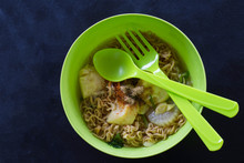 Top View Instant Noodle In A Bowl Of Green
